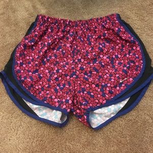 Pink patterned Nike running shorts